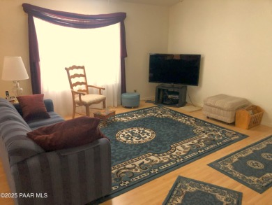 Fabulous home at a fabulous price! Long time owners have taken on Quail Wood Greens Golf Course in Arizona - for sale on GolfHomes.com, golf home, golf lot