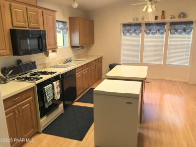 Fabulous home at a fabulous price! Long time owners have taken on Quail Wood Greens Golf Course in Arizona - for sale on GolfHomes.com, golf home, golf lot