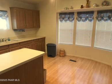 Fabulous home at a fabulous price! Long time owners have taken on Quail Wood Greens Golf Course in Arizona - for sale on GolfHomes.com, golf home, golf lot