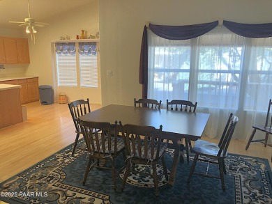 Fabulous home at a fabulous price! Long time owners have taken on Quail Wood Greens Golf Course in Arizona - for sale on GolfHomes.com, golf home, golf lot