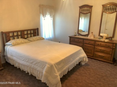 Fabulous home at a fabulous price! Long time owners have taken on Quail Wood Greens Golf Course in Arizona - for sale on GolfHomes.com, golf home, golf lot