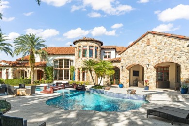 Welcome to this grand residence nestled on a sprawling 1.17 acre on Isleworth Golf and Country Club in Florida - for sale on GolfHomes.com, golf home, golf lot