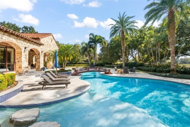 Welcome to this grand residence nestled on a sprawling 1.17 acre on Isleworth Golf and Country Club in Florida - for sale on GolfHomes.com, golf home, golf lot