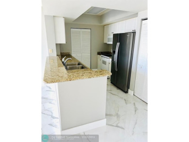 GORGEOUS UNIT AT TURNBERRY ON THE GREEN OVERLOOKING THE CITY OF on Turnberry Isle Resort and Club in Florida - for sale on GolfHomes.com, golf home, golf lot