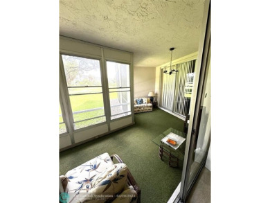 Ground floor 2 bedroom, 2 bath condo with over 1,500 sqft in on Palm-Aire Country Club and Resort - The Oaks in Florida - for sale on GolfHomes.com, golf home, golf lot