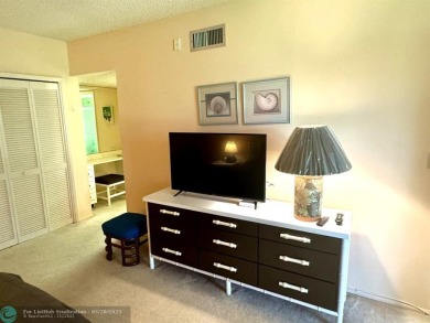 Ground floor 2 bedroom, 2 bath condo with over 1,500 sqft in on Palm-Aire Country Club and Resort - The Oaks in Florida - for sale on GolfHomes.com, golf home, golf lot