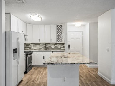 Beautifully updated 2 bedroom, 2 bath condo with a large balcony on Hunters Green Country Club in Florida - for sale on GolfHomes.com, golf home, golf lot