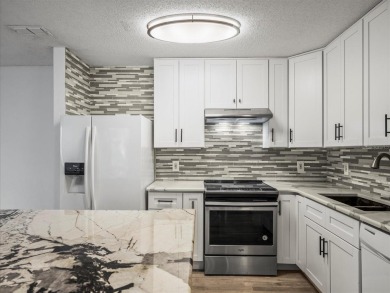 Beautifully updated 2 bedroom, 2 bath condo with a large balcony on Hunters Green Country Club in Florida - for sale on GolfHomes.com, golf home, golf lot