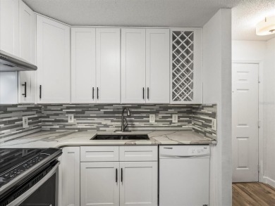 Beautifully updated 2 bedroom, 2 bath condo with a large balcony on Hunters Green Country Club in Florida - for sale on GolfHomes.com, golf home, golf lot