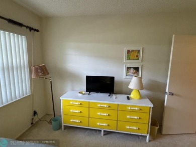 Ground floor 2 bedroom, 2 bath condo with over 1,500 sqft in on Palm-Aire Country Club and Resort - The Oaks in Florida - for sale on GolfHomes.com, golf home, golf lot
