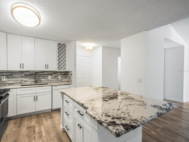 Beautifully updated 2 bedroom, 2 bath condo with a large balcony on Hunters Green Country Club in Florida - for sale on GolfHomes.com, golf home, golf lot