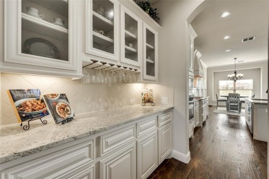 Elegant 1.5-story home at 2000 Fox Bend Trace in the Bridges at on The Bridges Golf Club in Texas - for sale on GolfHomes.com, golf home, golf lot