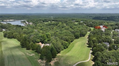 Water view sprawling ranch  home in beautiful Raintreee on Raintree Country Club in Missouri - for sale on GolfHomes.com, golf home, golf lot