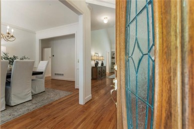 Nestled on a beautifully landscaped half-acre lot in on Chapel Hills Golf and Country Club in Georgia - for sale on GolfHomes.com, golf home, golf lot