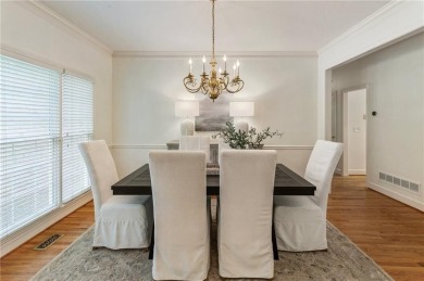 Nestled on a beautifully landscaped half-acre lot in on Chapel Hills Golf and Country Club in Georgia - for sale on GolfHomes.com, golf home, golf lot
