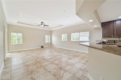 STUNNING, SPACIOUS 2ND-FLOOR END UNIT BOASTING NEARLY 2,000 on Gateway Golf and Country Club in Florida - for sale on GolfHomes.com, golf home, golf lot