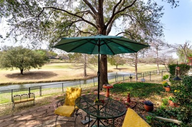 Expansive golf course and water views showcase this welcoming on Hackberry Creek Country Club in Texas - for sale on GolfHomes.com, golf home, golf lot