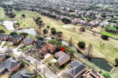 Expansive golf course and water views showcase this welcoming on Hackberry Creek Country Club in Texas - for sale on GolfHomes.com, golf home, golf lot
