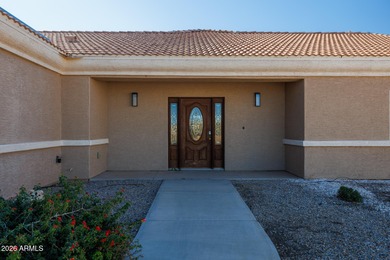 Stunning 3-bedroom home with a 3-car garage perfectly positioned on Arizona City Golf Club in Arizona - for sale on GolfHomes.com, golf home, golf lot