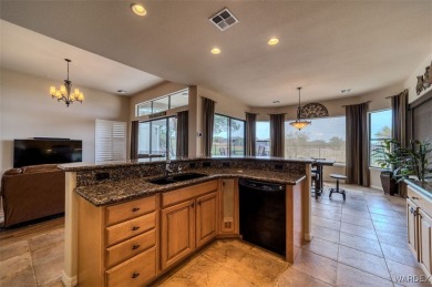 Imagine stepping into a stunning 3 bedroom 2 bath home nestled on Laughlin Ranch Golf Club in Arizona - for sale on GolfHomes.com, golf home, golf lot