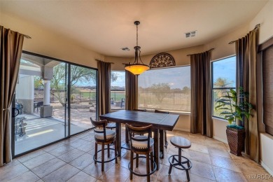 Imagine stepping into a stunning 3 bedroom 2 bath home nestled on Laughlin Ranch Golf Club in Arizona - for sale on GolfHomes.com, golf home, golf lot