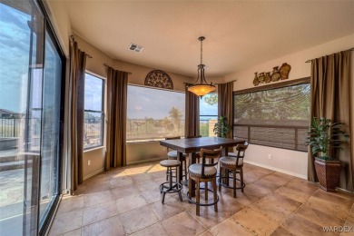 Imagine stepping into a stunning 3 bedroom 2 bath home nestled on Laughlin Ranch Golf Club in Arizona - for sale on GolfHomes.com, golf home, golf lot