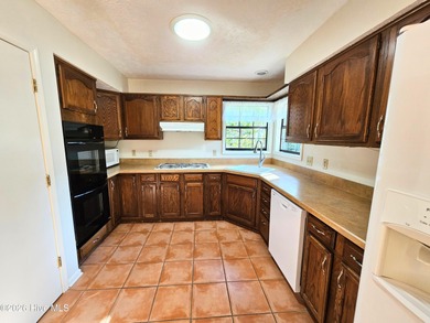 What a happy house! Bright and cheery to welcome you home! This on Carolina Shores Golf Course in North Carolina - for sale on GolfHomes.com, golf home, golf lot