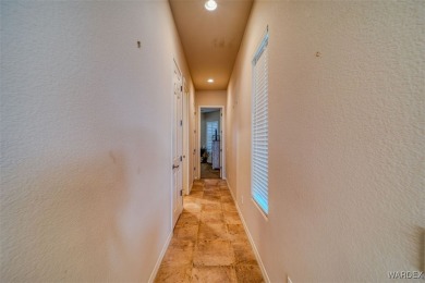 Imagine stepping into a stunning 3 bedroom 2 bath home nestled on Laughlin Ranch Golf Club in Arizona - for sale on GolfHomes.com, golf home, golf lot