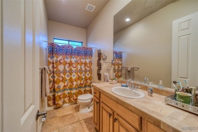 Imagine stepping into a stunning 3 bedroom 2 bath home nestled on Laughlin Ranch Golf Club in Arizona - for sale on GolfHomes.com, golf home, golf lot