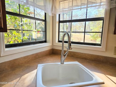 What a happy house! Bright and cheery to welcome you home! This on Carolina Shores Golf Course in North Carolina - for sale on GolfHomes.com, golf home, golf lot