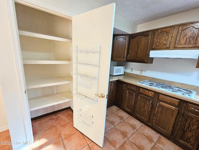 What a happy house! Bright and cheery to welcome you home! This on Carolina Shores Golf Course in North Carolina - for sale on GolfHomes.com, golf home, golf lot