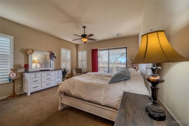 Imagine stepping into a stunning 3 bedroom 2 bath home nestled on Laughlin Ranch Golf Club in Arizona - for sale on GolfHomes.com, golf home, golf lot