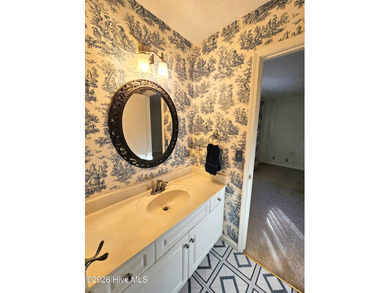 What a happy house! Bright and cheery to welcome you home! This on Carolina Shores Golf Course in North Carolina - for sale on GolfHomes.com, golf home, golf lot