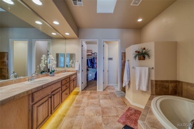 Imagine stepping into a stunning 3 bedroom 2 bath home nestled on Laughlin Ranch Golf Club in Arizona - for sale on GolfHomes.com, golf home, golf lot