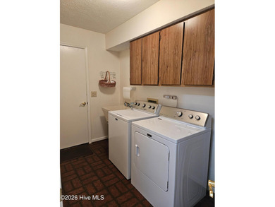 What a happy house! Bright and cheery to welcome you home! This on Carolina Shores Golf Course in North Carolina - for sale on GolfHomes.com, golf home, golf lot