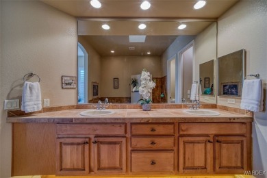 Imagine stepping into a stunning 3 bedroom 2 bath home nestled on Laughlin Ranch Golf Club in Arizona - for sale on GolfHomes.com, golf home, golf lot