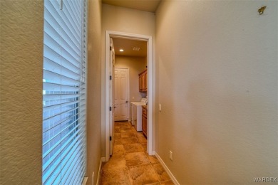 Imagine stepping into a stunning 3 bedroom 2 bath home nestled on Laughlin Ranch Golf Club in Arizona - for sale on GolfHomes.com, golf home, golf lot