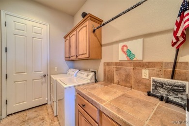 Imagine stepping into a stunning 3 bedroom 2 bath home nestled on Laughlin Ranch Golf Club in Arizona - for sale on GolfHomes.com, golf home, golf lot