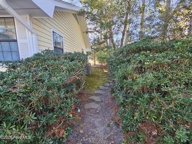 What a happy house! Bright and cheery to welcome you home! This on Carolina Shores Golf Course in North Carolina - for sale on GolfHomes.com, golf home, golf lot