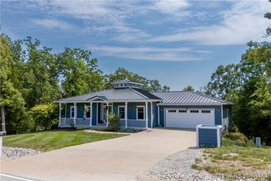 This charming Craftsman-style home, nestled in a prime location on Tan-Tar-A Golf Club in Missouri - for sale on GolfHomes.com, golf home, golf lot