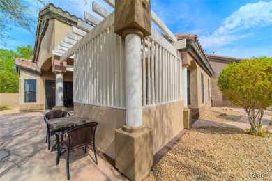 Imagine stepping into a stunning 3 bedroom 2 bath home nestled on Laughlin Ranch Golf Club in Arizona - for sale on GolfHomes.com, golf home, golf lot