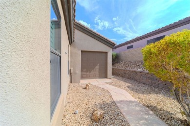 Imagine stepping into a stunning 3 bedroom 2 bath home nestled on Laughlin Ranch Golf Club in Arizona - for sale on GolfHomes.com, golf home, golf lot