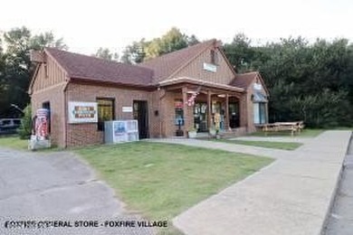 This stunning 2.67-acre parcel is a combination of two lots, lot on Foxfire Golf and Country Club in North Carolina - for sale on GolfHomes.com, golf home, golf lot