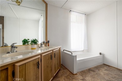 Come check out this charming ground-level manufactured home in on Colonial Country Club in California - for sale on GolfHomes.com, golf home, golf lot