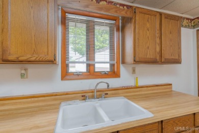 What a great little starter home or a place to hang your hat on George Young Golf Course in Michigan - for sale on GolfHomes.com, golf home, golf lot