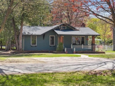 This brilliantly restored home delivers comfort, charm, and on Charlevoix Golf Club in Michigan - for sale on GolfHomes.com, golf home, golf lot