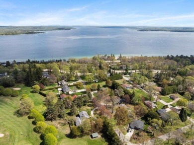 This brilliantly restored home delivers comfort, charm, and on Charlevoix Golf Club in Michigan - for sale on GolfHomes.com, golf home, golf lot