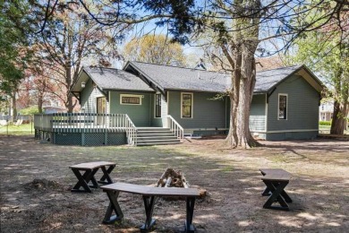 This brilliantly restored home delivers comfort, charm, and on Charlevoix Golf Club in Michigan - for sale on GolfHomes.com, golf home, golf lot