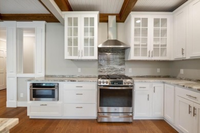 This brilliantly restored home delivers comfort, charm, and on Charlevoix Golf Club in Michigan - for sale on GolfHomes.com, golf home, golf lot