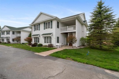 Welcome to this upper-level 2-bedroom, 2-bath condo in the on Charlevoix Golf and Country Club in Michigan - for sale on GolfHomes.com, golf home, golf lot